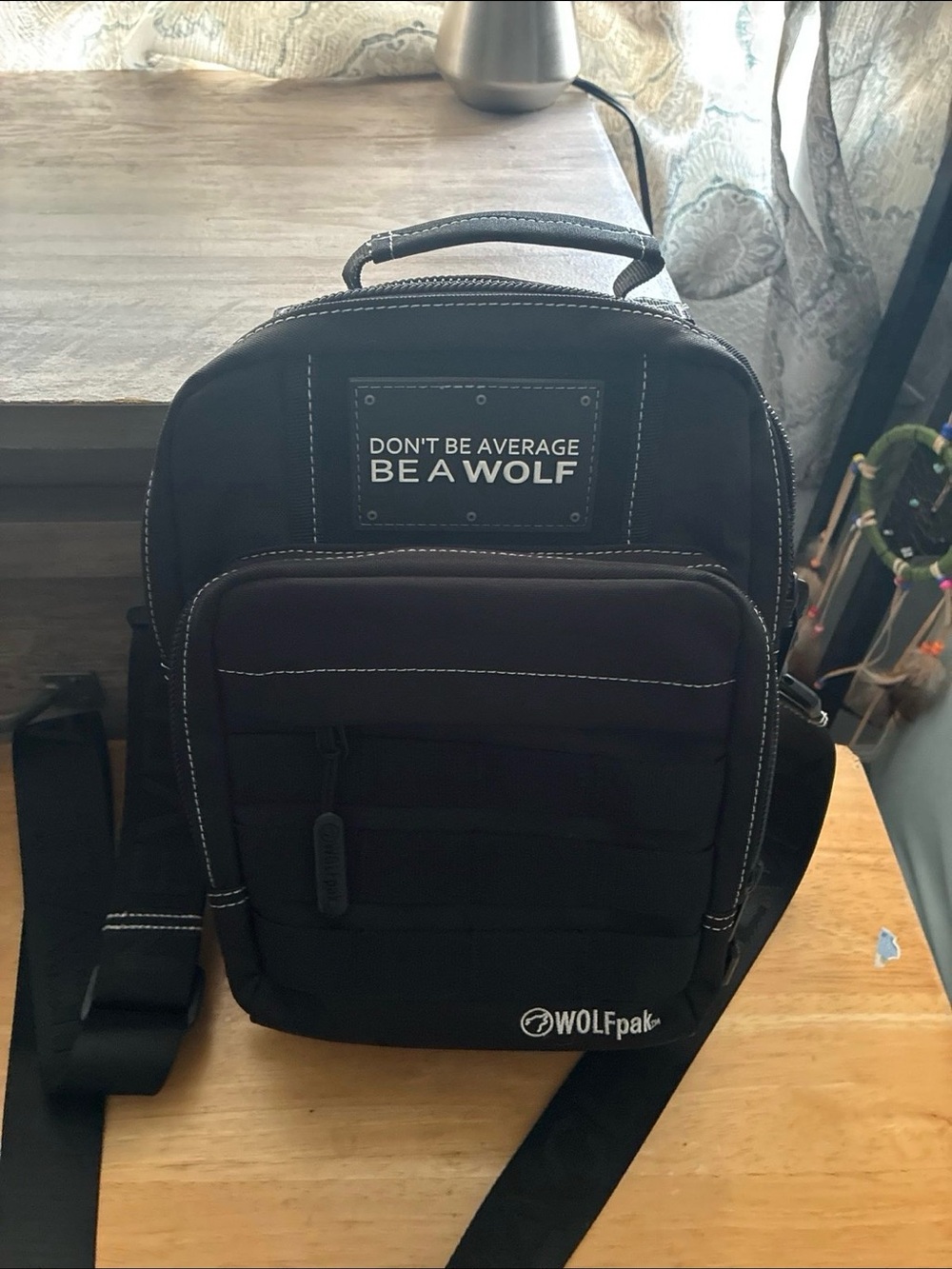 WOLF Black Crossbody Sling Bag with White Logo Patch